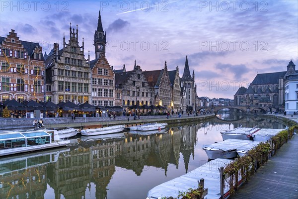 Medieval guild houses of Graslei Kai on the river Leie at dusk, Ghent, Belgium, Europe