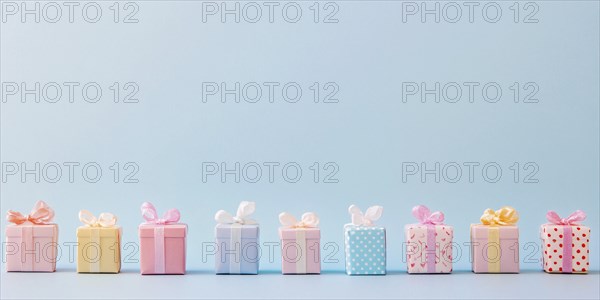 Small gift boxes on pastel blue background. Generative Ai, AI generated
