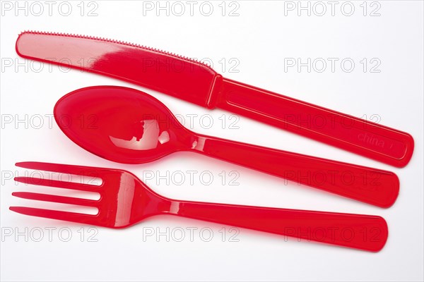 Disposable cutlery, red plastic cutlery, plastic knife, plastic fork, plastic spoon