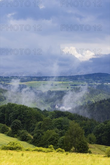 Scharfenstein Castle seen through the rain and fog