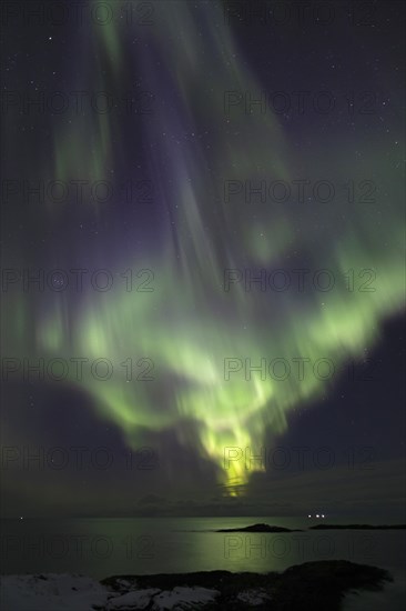 Northern Lights (Aurora borealis) in green and blue over the North Sea, Andoya, Vesteralen, Norway,