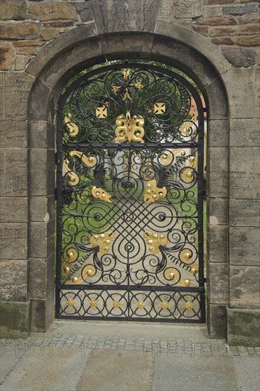 Golden gate with lattice and entrance to the Green Cemetery of St. Mary's Cathedral, wrought iron