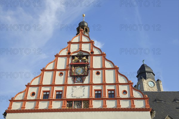 Tail gable with sundial and coat of arms of the Old Town Hall built 1382 and tower of the New Town
