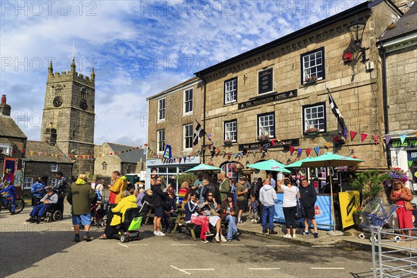 Crowd in town centre, traditional Lafrowda Festival 2023, St Just in Penwith, Cornwall, England,