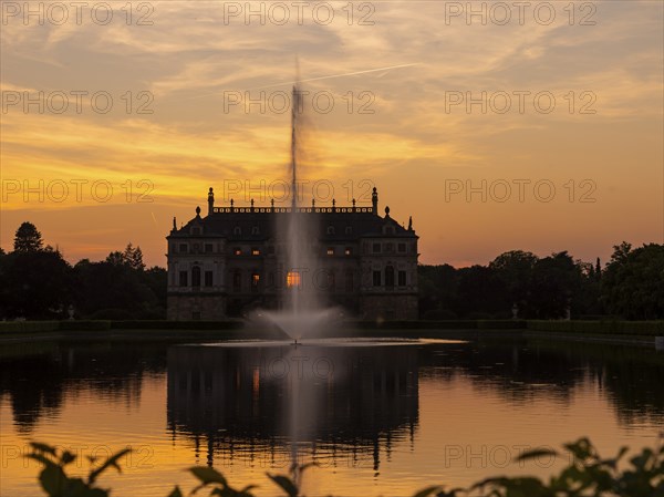 Evening atmosphere at the Palais Pond with the Palais in the Great Garden