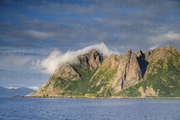 Mountains by the sea, fjord, fishing village Hovden, island Langoya, archipelago Vesteralen,