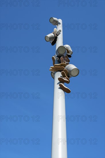 Trainers hanging from a modern light pole, Berlin, Germany, Europe