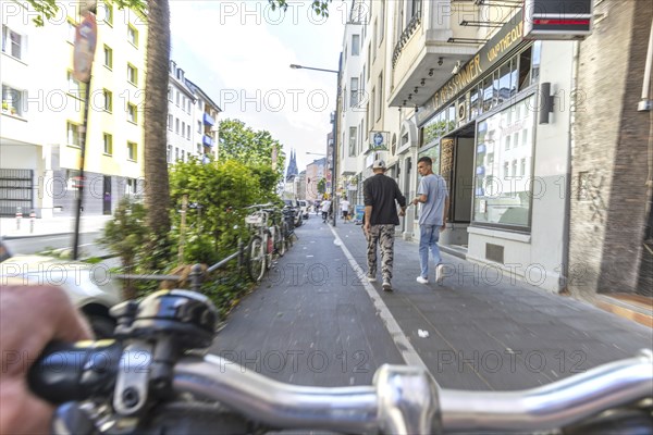 Cycling from a first-person perspective on a cycle path in Cologne, North Rhine-Westphalia,