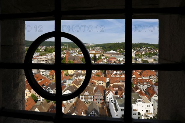 View of the town of Heidenheim through iron bars, Hellenstein Castle, buildings, houses, church,