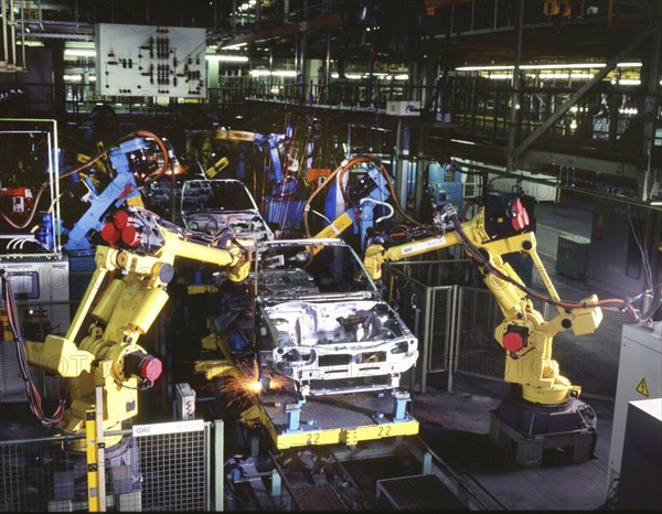 Industry, production, automation of the car industry, worker at conveyor belt, robot, 12 06 1995