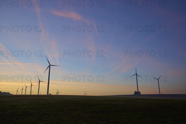 Wind turbines at dawn in the morning, Wertheim, Baden-Württemberg, Germany, Europe