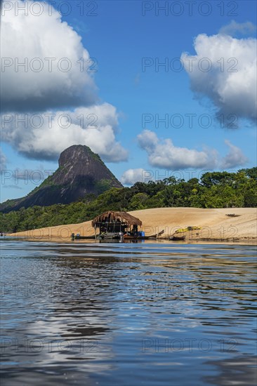 Illegal gold hut on the Mavecure river, before the granite hills, Cerros de Mavecure, Eastern