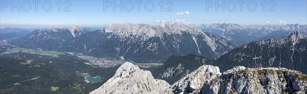 Aerial view, Alpine panorama, hikers at the summit cross, Westliche Wettersteinspitze, Wetterstein