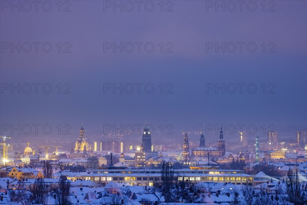 View from the Dresdner Heller to the wintery snow-covered Dresden Old Town with its towers