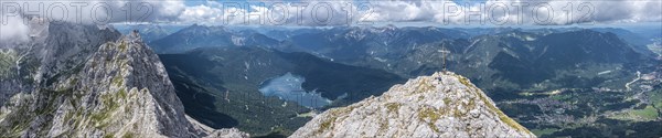 Aerial view, summit cross of the Waxenstein, Eibsee lake and Wetterstein mountains,