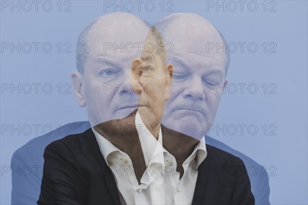 Photo taken as a double exposure. Olaf Scholz (SPD), Federal Chancellor, taken at a federal press