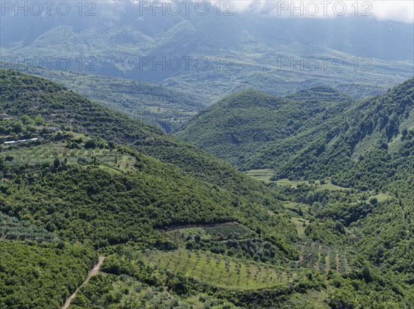 Wooded slopes and Mediterranean agriculture on the western foothills of the Tomorr Massif in Tomorr