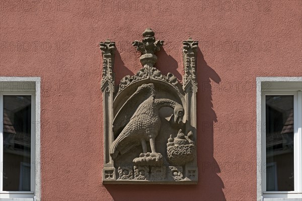 House sign, relief, eagle feeding its young in the nest, Bergstr. 13 ud 15, Nuremberg, Middle