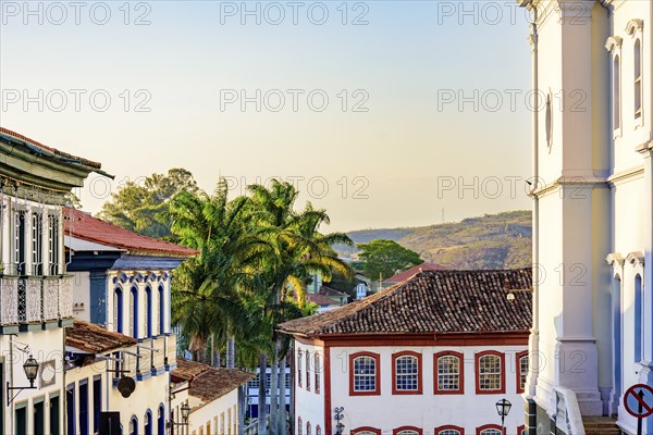 Historic center of the city of Diamantina with its colonial-style houses, hill and palm trees,