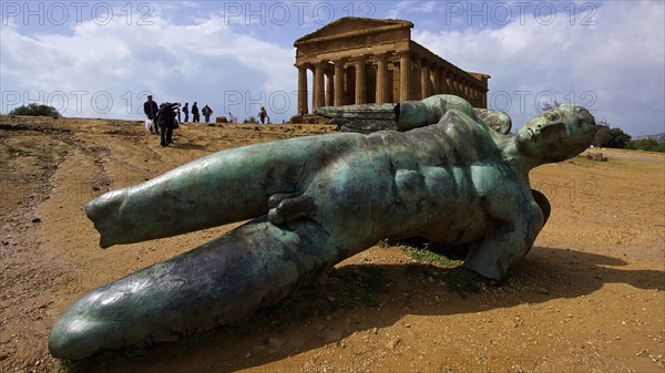 Super wide angle shot, bronze statue of fallen Icarus, Concordia Temple, Valley of the Temples,