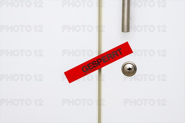 Locked, tape on taped office cupboard door