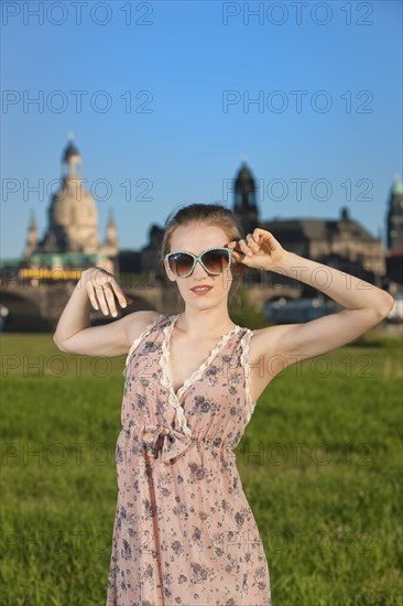 Young woman on the Elbe meadows in Dresden