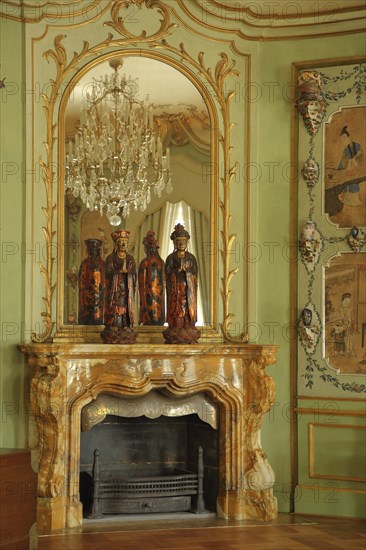 Chinese room with wall mirror, chandelier, fireplace, stucco and ornaments, interior view, castle,