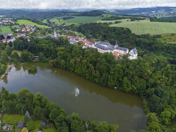 Wildenfels Castle rises on a mountain spur above the town of Wildenfels near Zwickau in Saxony. It