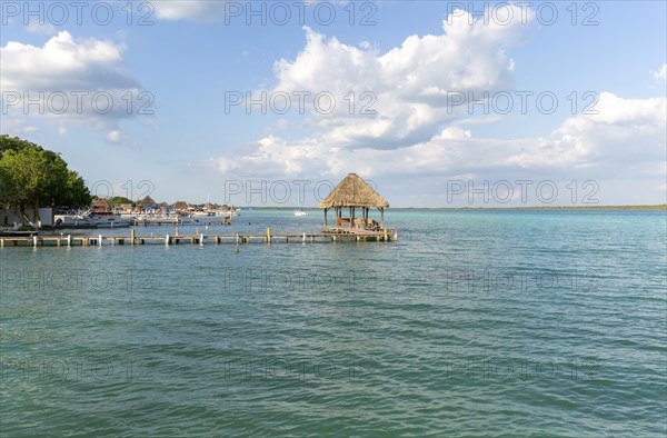 Cabana thatched cabin on wooden jetty Lake Bacalar, Bacalar, Quintana Roo, Yucatan Peninsula,