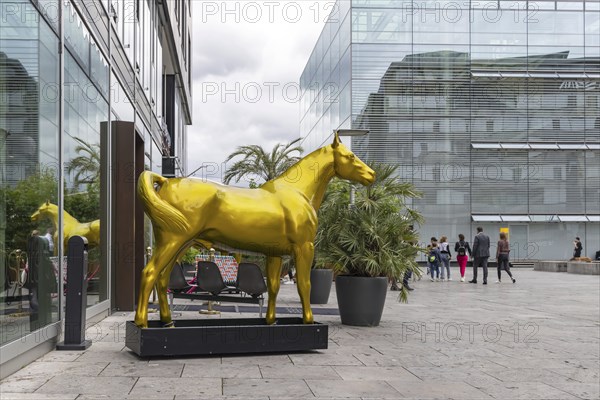 Small Schlossplatz Stuttgart with art museum. A horse made of plastic at the entrance to a shop,