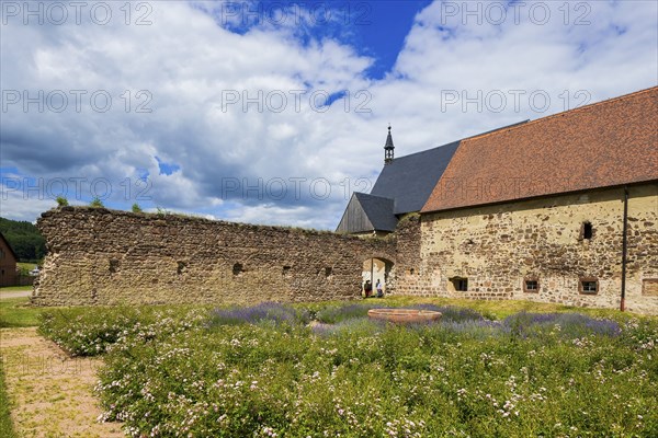 DEU Saxony Klosterbuch Area of the former cloister with Romanesque fountain bowl in the Kreugarten