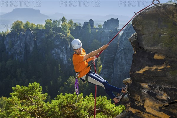 Climbers in Rathen in Saxon Switzerland