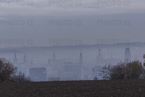 View from Dresden's Südhöhe of the city centre with its towers sinking into the fog