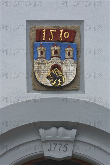 City coat of arms with year 1510 and 1775 on the town hall, Obermarkt, Freiberg, Saxony, Germany,