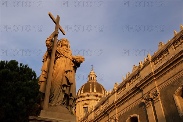 Super wide angle shot, sculpture, Fortes in Fide, with cross, evening light, Cathedral, Catania,