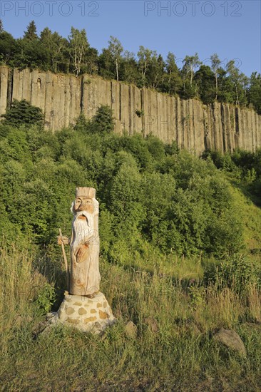Organ pipes with basalt columns and wooden sculpture, wooden figure, chainsaw art, woodcarving,