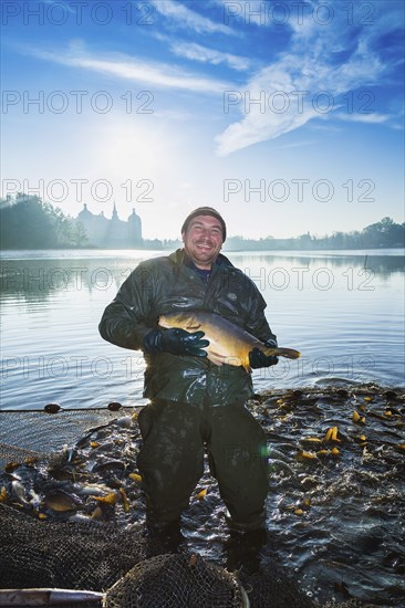Fishing of the castle pond in Moritzburg