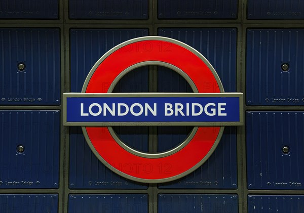 London Bridge' underground sign in blue and red, iconic for London's transport system, London,