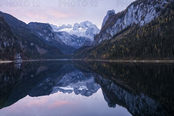 The Vordere Gosausee lake in autumn with a view of the Dachstein mountain range. The Gosaukamm on