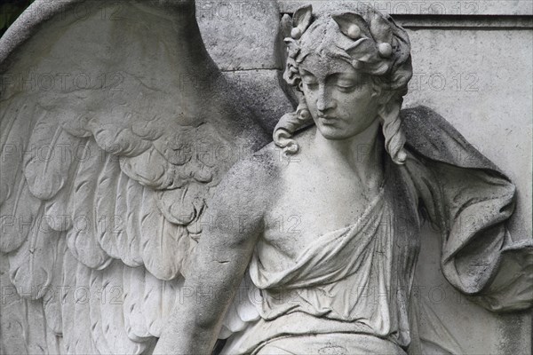 Cemetery mourning statue of a woman
