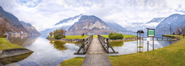 Late autumn panorama with the Hallstatter lake, the Northern Limestone Alps, the island on the lake