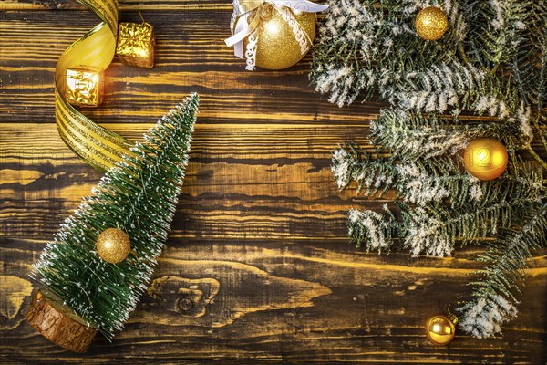 Christmas tree and toys on wooden background