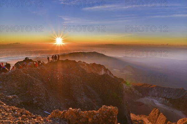 People on the summit of volcano Rinjani watching sunrise, Lombok, Indonesia, Asia