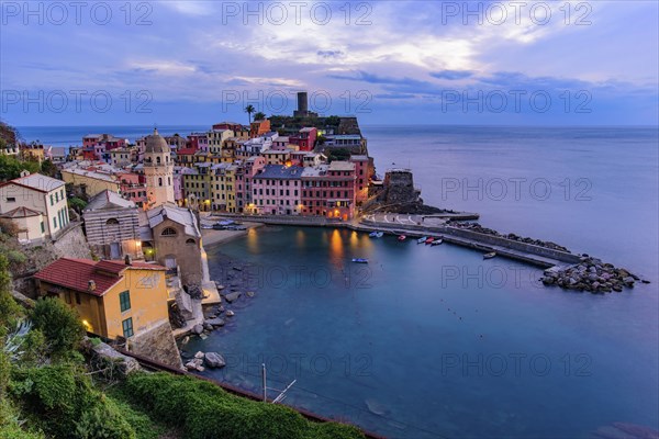 Sunset view of Vernazza, one of the five Mediterranean villages in Cinque Terre, Italy, famous for
