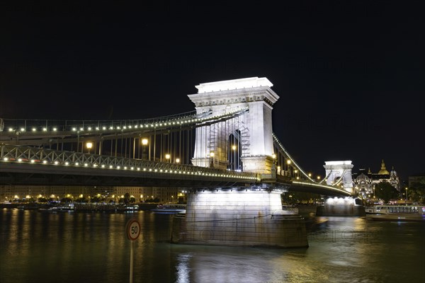 Night view of Széchenyi Chain Bridge across the River Danube connecting Buda and Pest, Budapest,