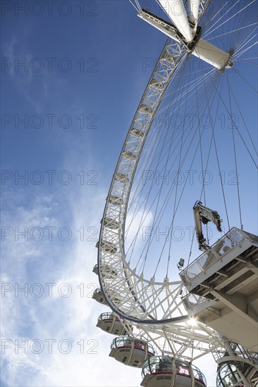 London Eye Ferris wheel under a sunny sky, impressive modern construction, London, United Kingdom