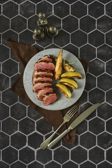 A spicy gourmet dish in which the duck breast is perfectly baked with golden apples and pears