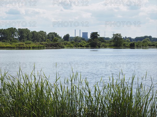 View of a lake with a power station behind it, Roermond, Netherlands
