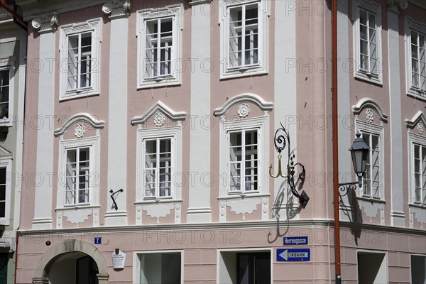 Historic building with pink façade and white shutters, Herrengasse 2, Innere Stadt, Klagenfurt,