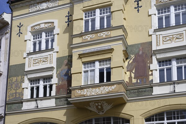 Historic building with elaborate façade paintings and decorative stucco elements, Leonhaus,